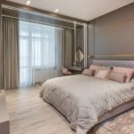 Stylish bedroom interior with comfortable bed and vanity table